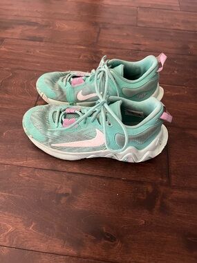 Nike Giannis Immortality 2 basketball shoes in a mint and purple colorway